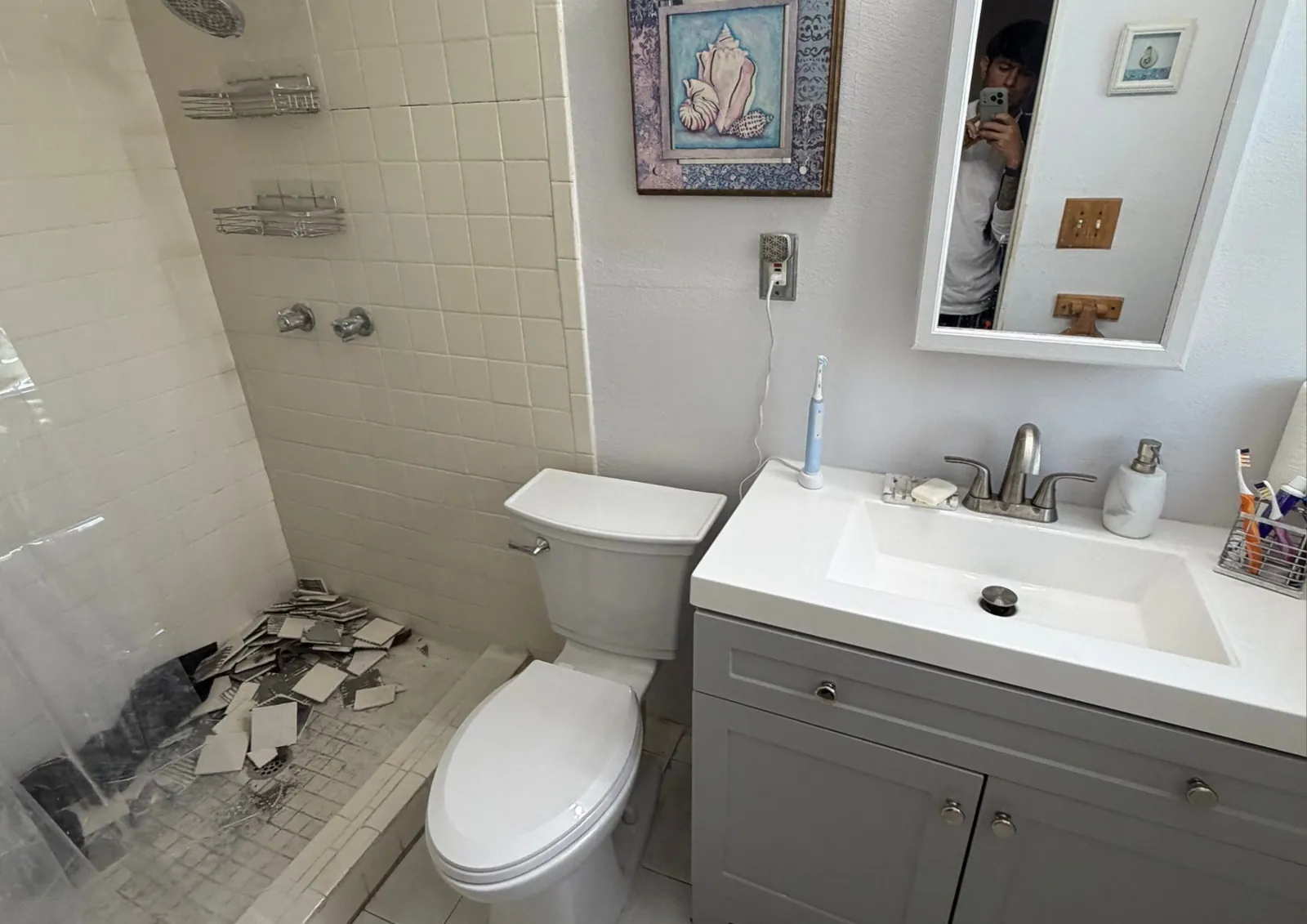 Guest bath before, with old tile and vanity