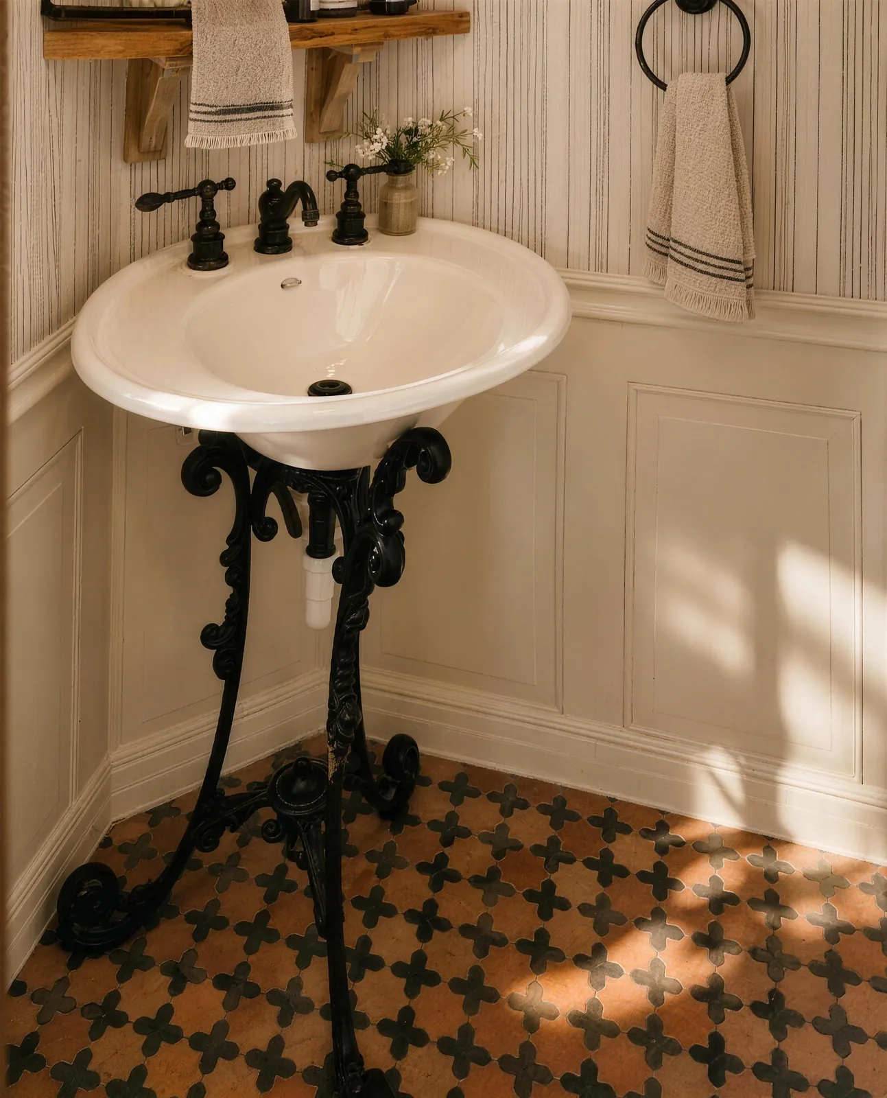 Powder room with a cast-iron pedestal sink