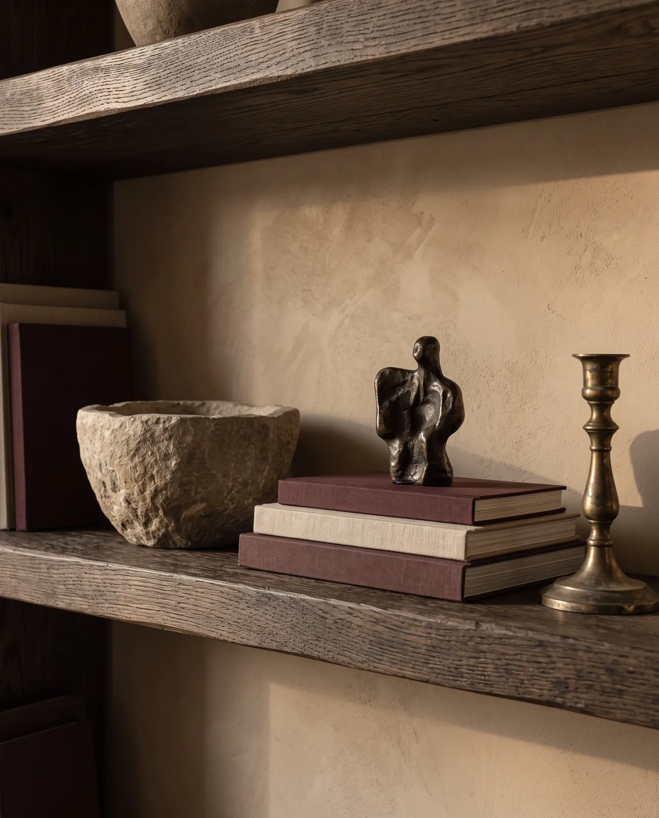 A curated shelf of objects in soft light